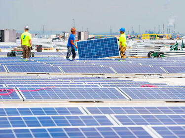 People installing solar panels